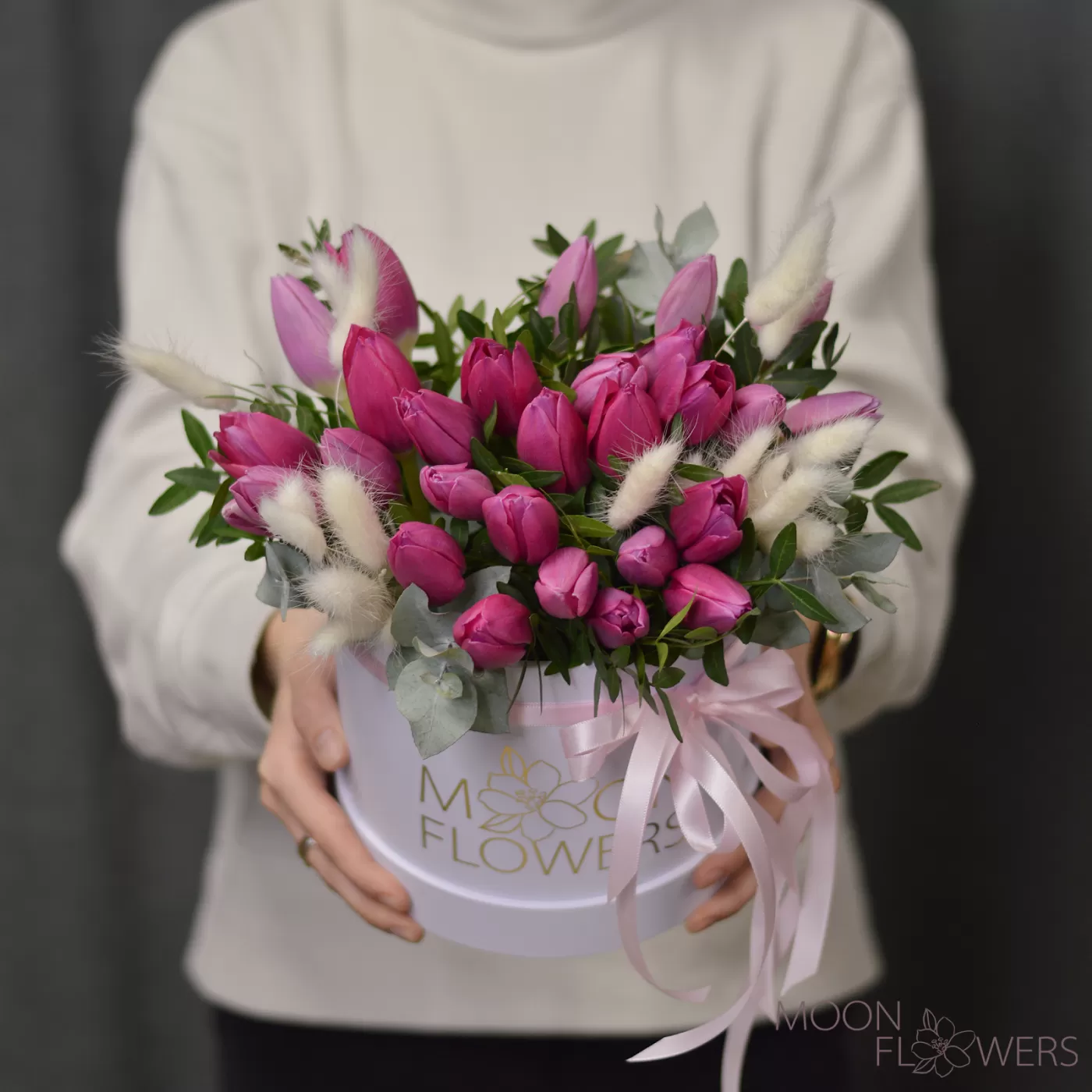 White box with pink tulips, eucalyptus and lagurus