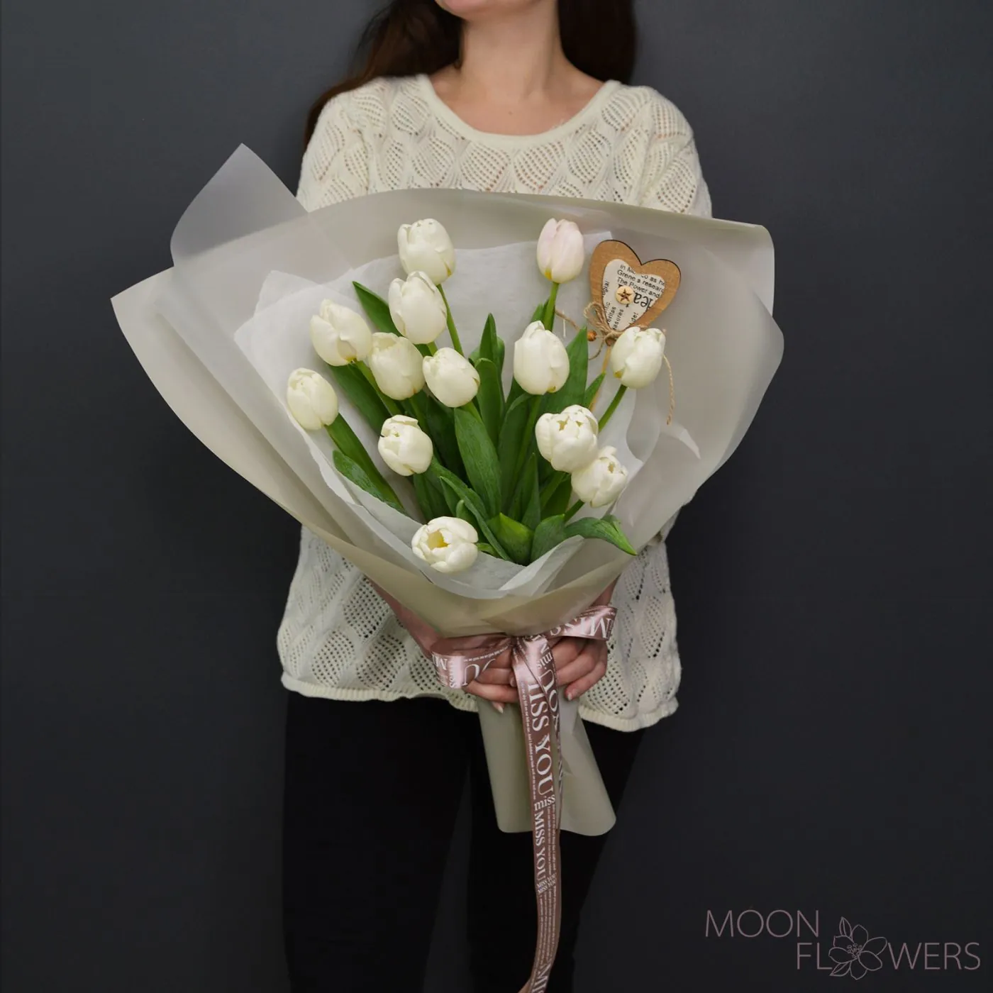 Bouquet of white Dutch tulips with a heart