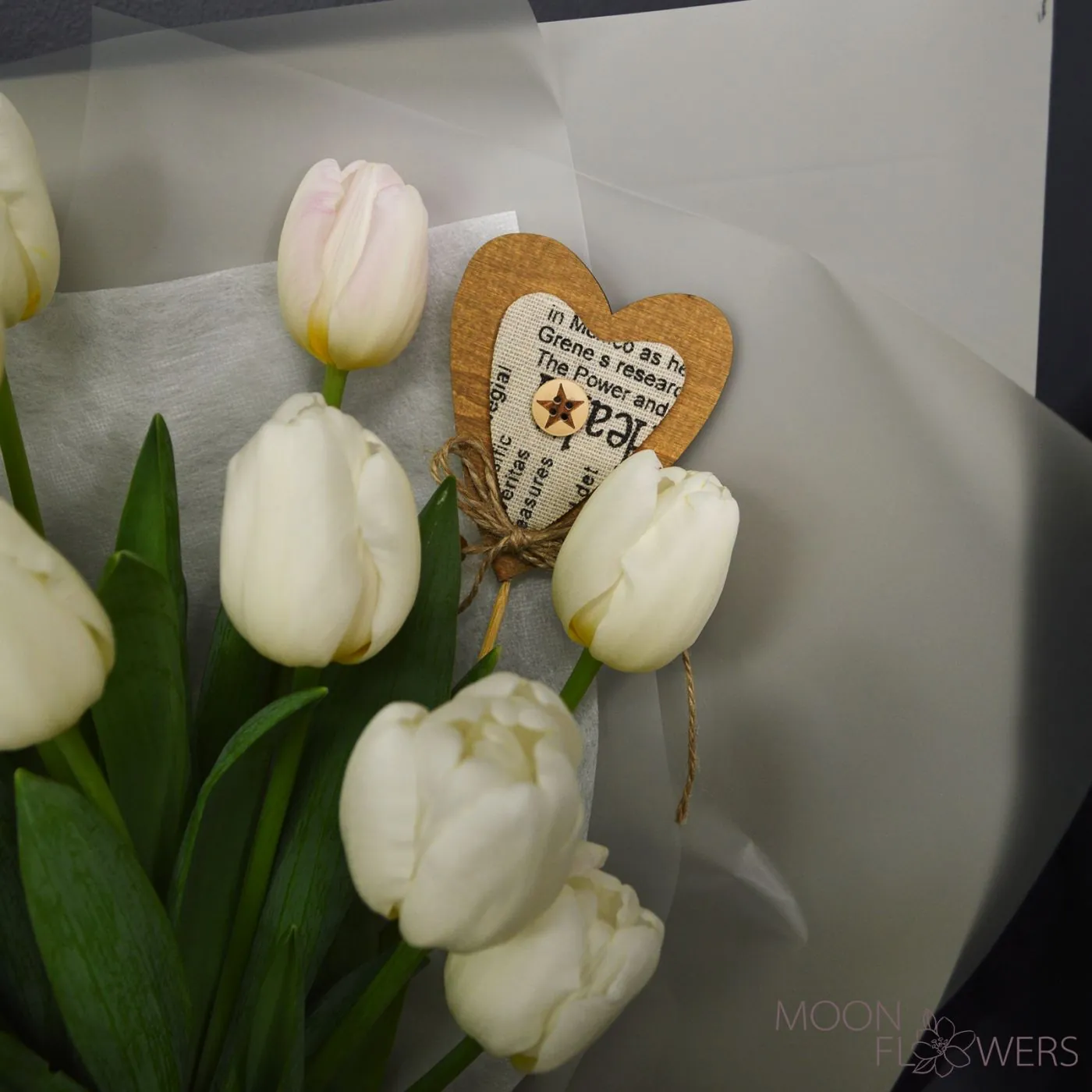 Bouquet of white Dutch tulips with a heart