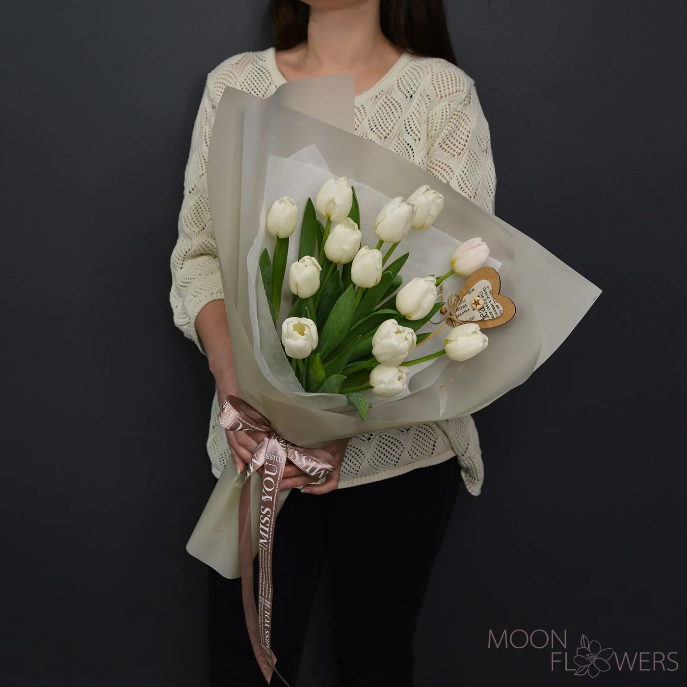 Bouquet of white Dutch tulips with a heart