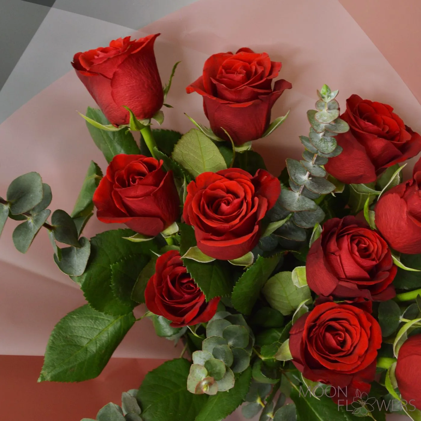 Bouquet of red roses and eucalyptus