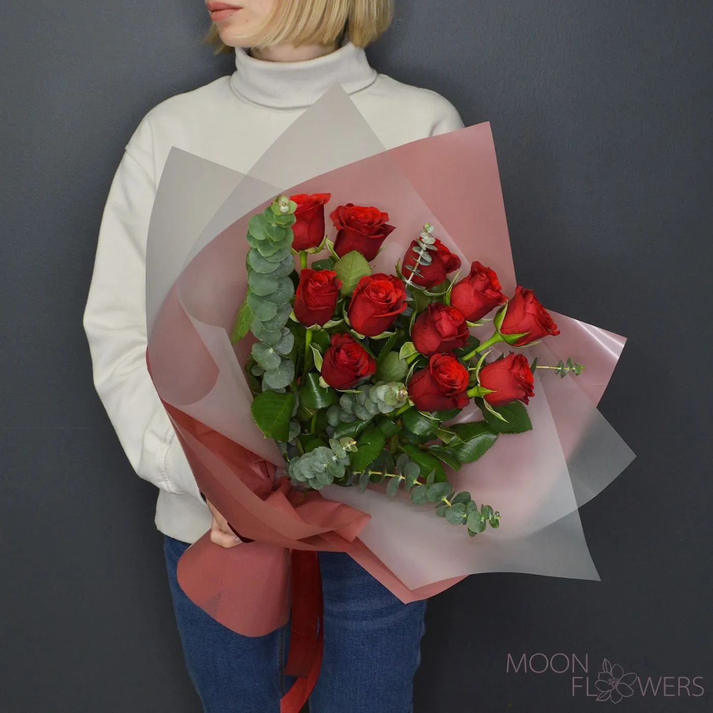 Bouquet of red roses and eucalyptus