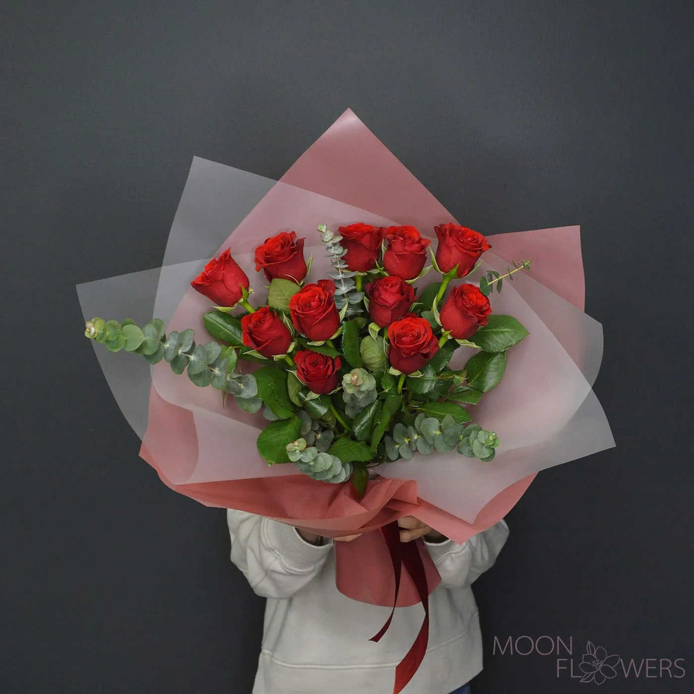 Bouquet of red roses and eucalyptus