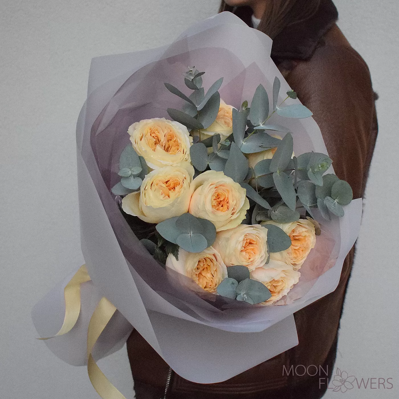 Bouquet of cream peony roses and eucalyptus