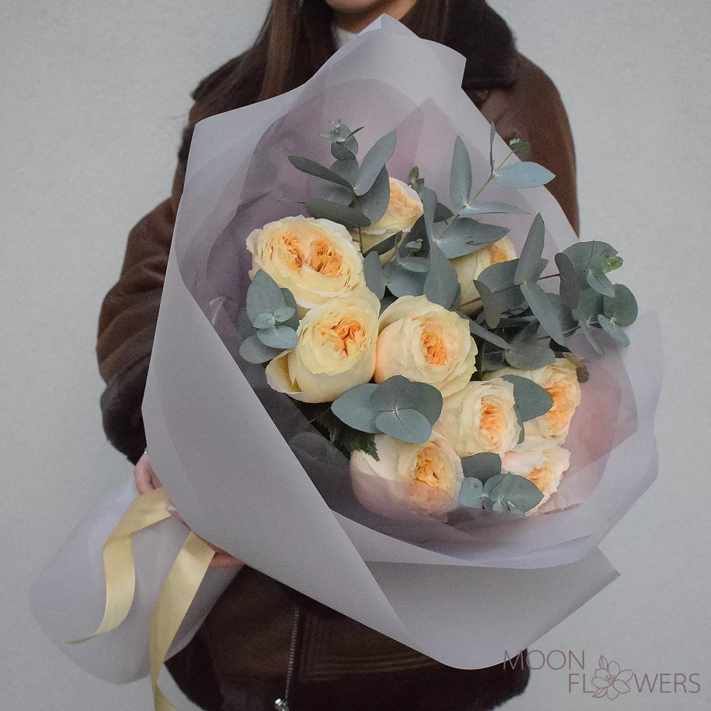 Bouquet of cream peony roses and eucalyptus