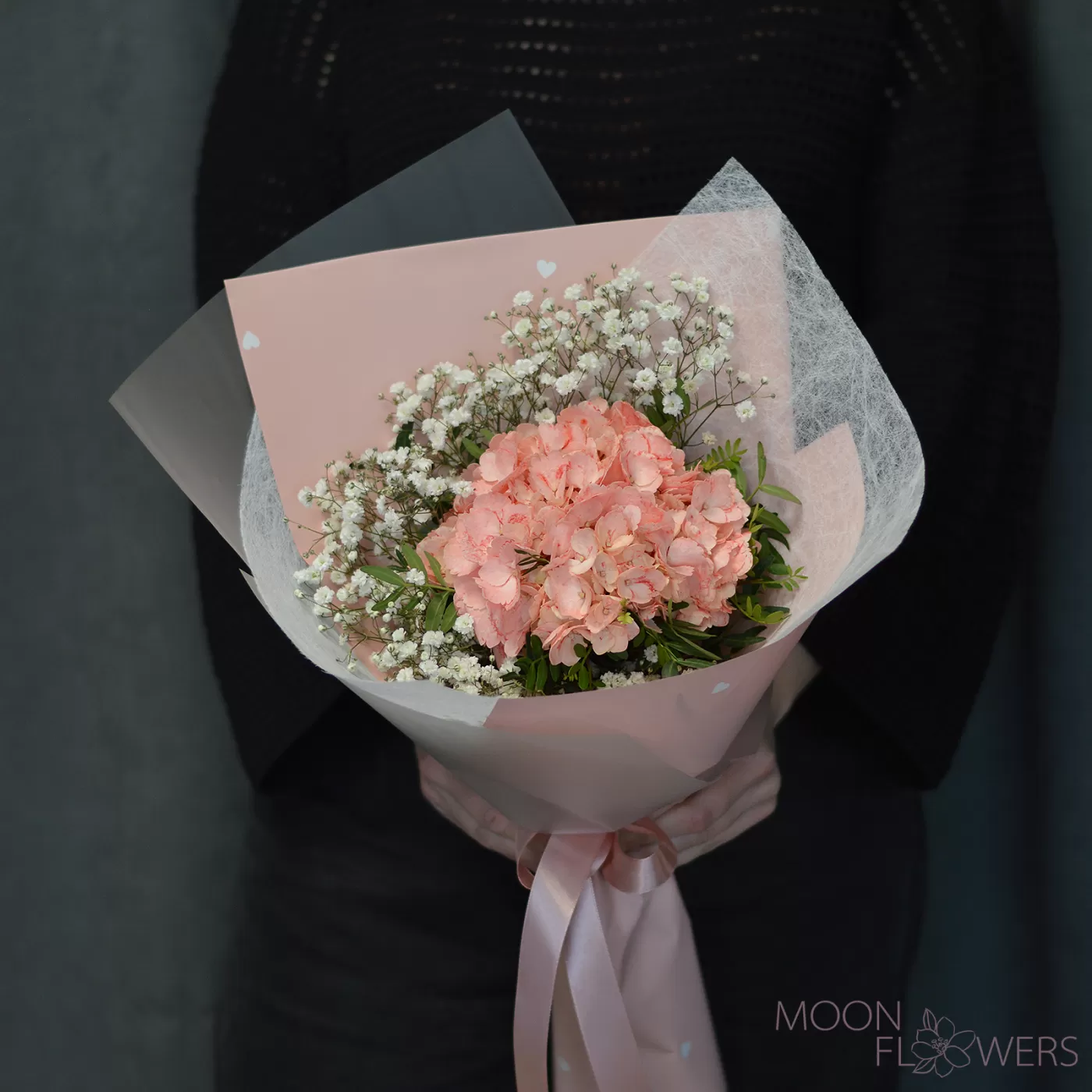 Bouquet of peach hydrangea and gypsophila