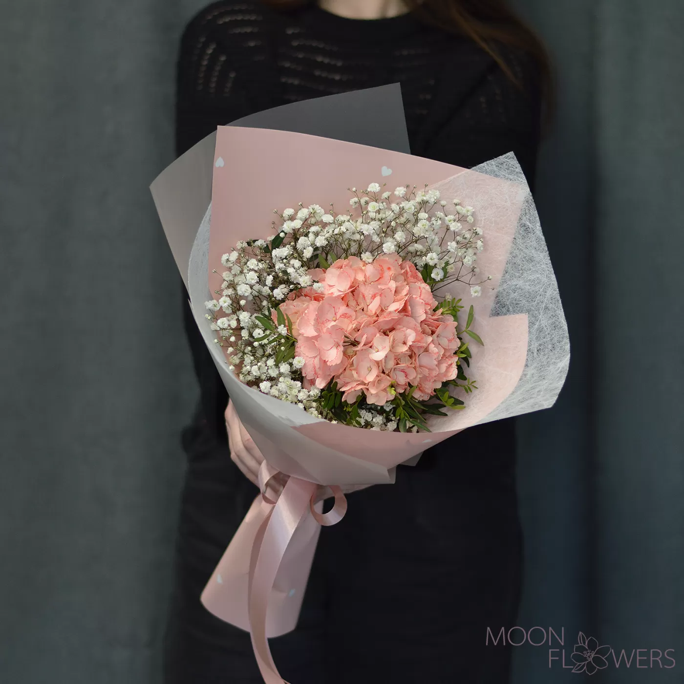 Bouquet of peach hydrangea and gypsophila
