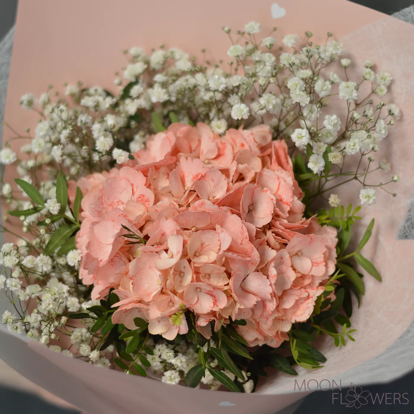 Bouquet of peach hydrangea and gypsophila