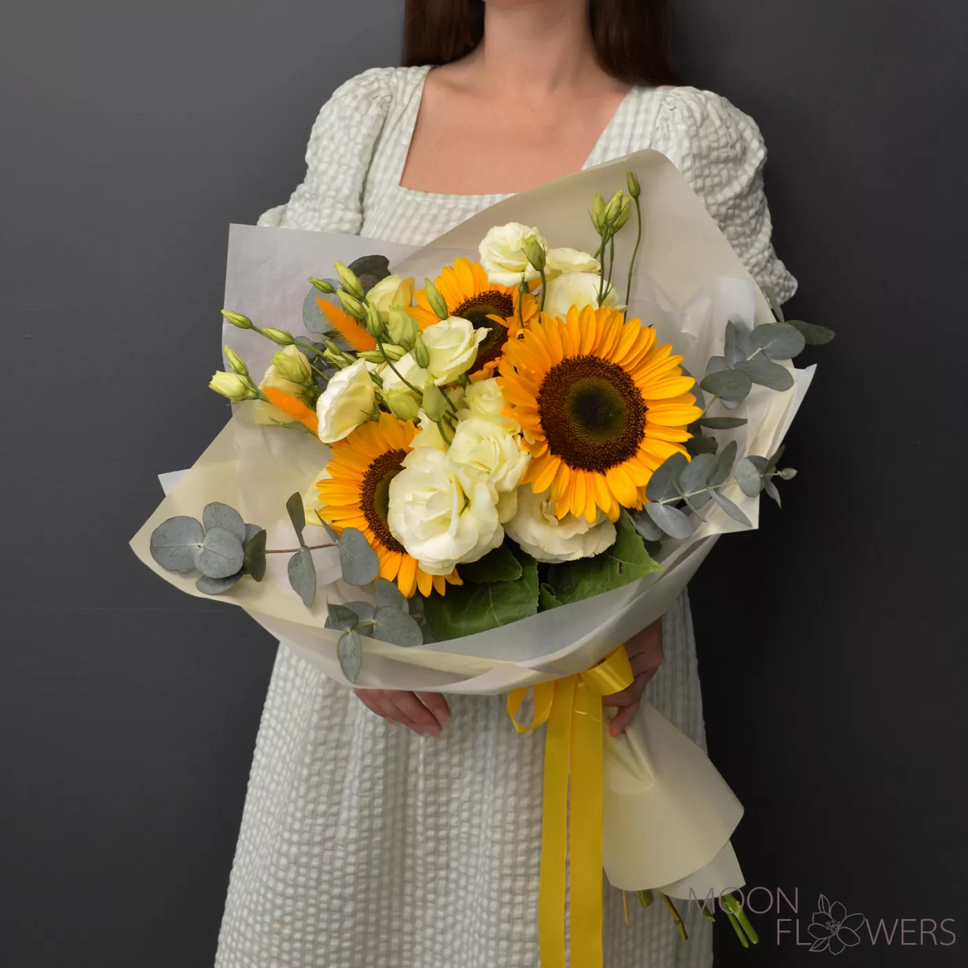 Bouquet of sunflower and beige eustoma