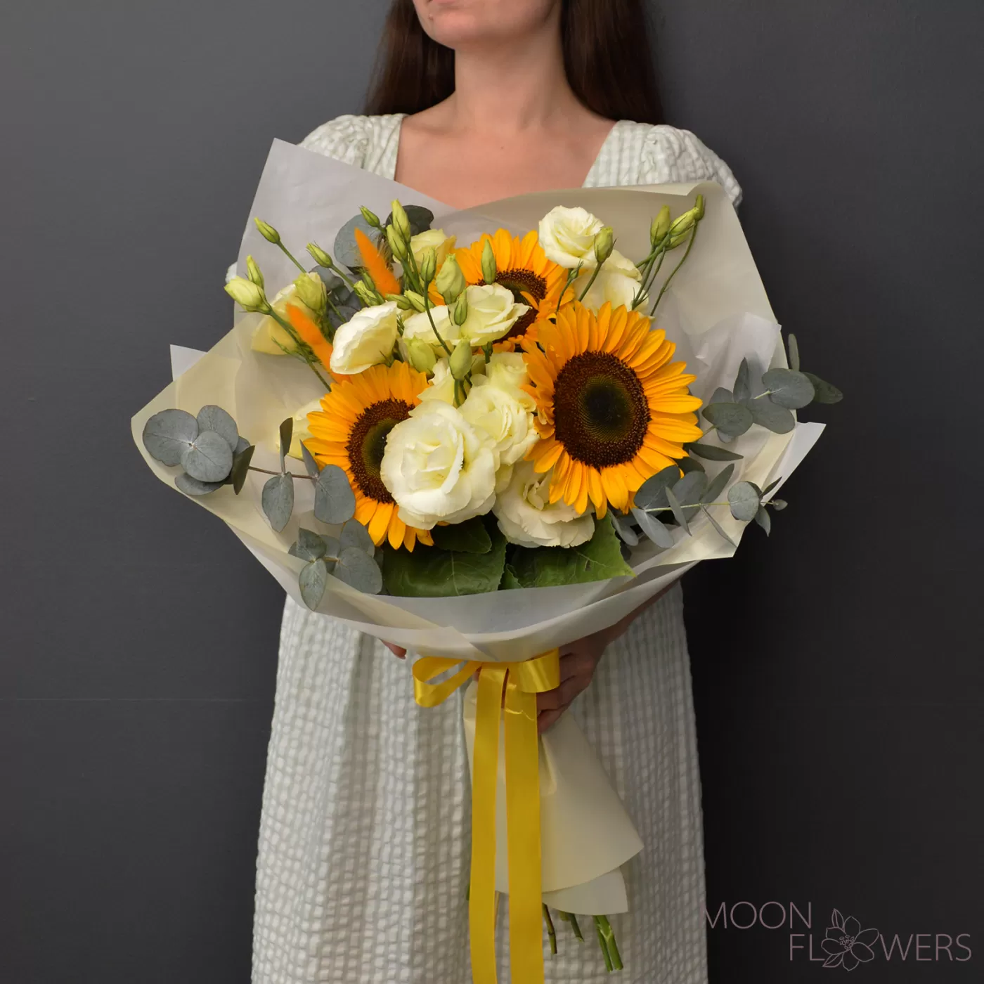 Bouquet of sunflower and beige eustoma