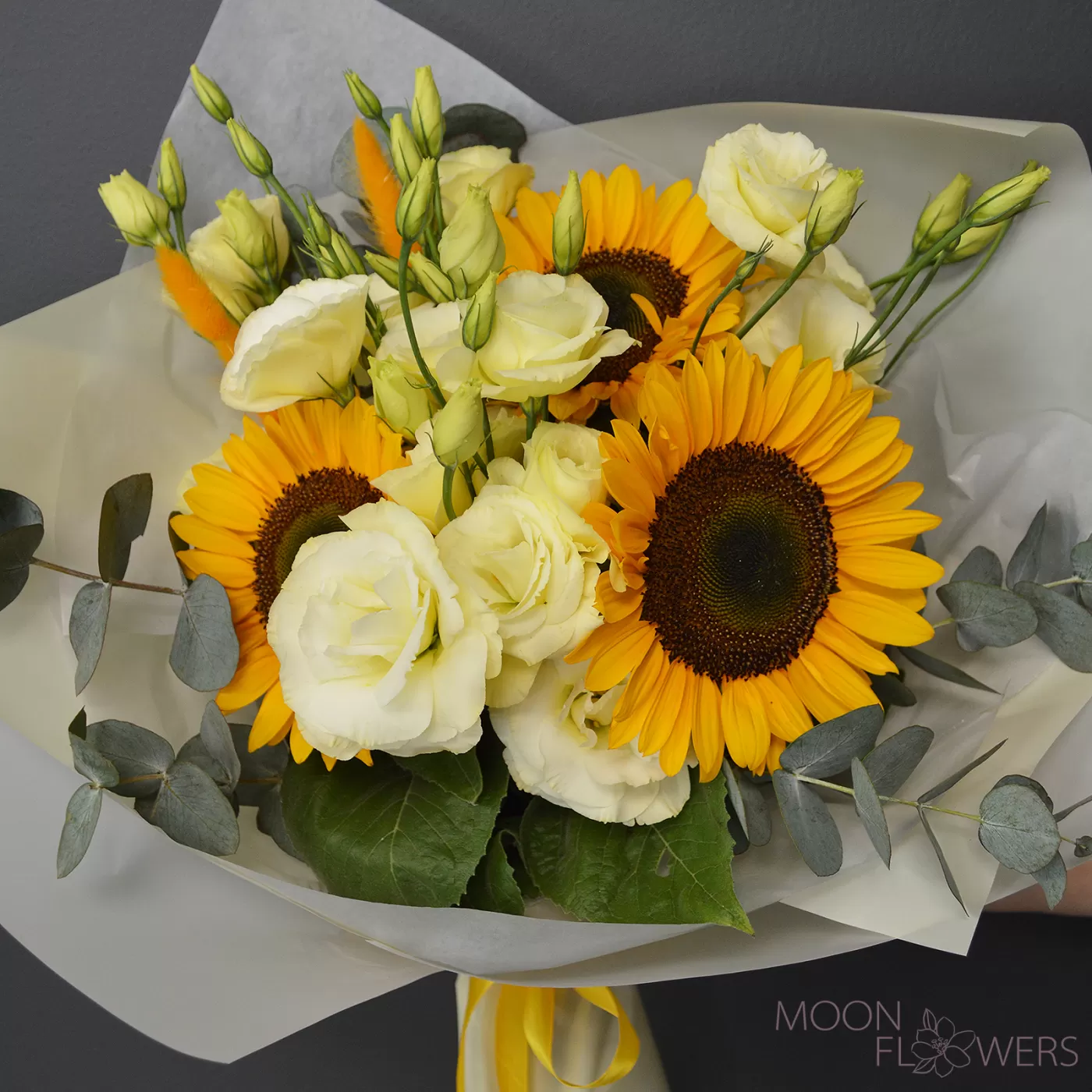 Bouquet of sunflower and beige eustoma