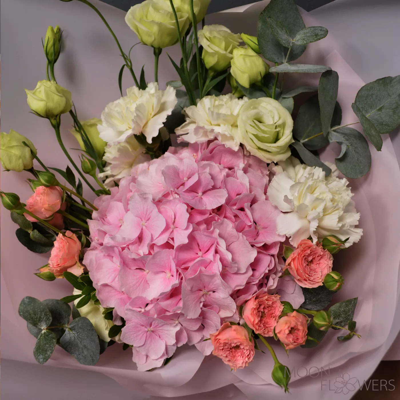 Bouquet of pink hydrangea, white carnations and eustoma