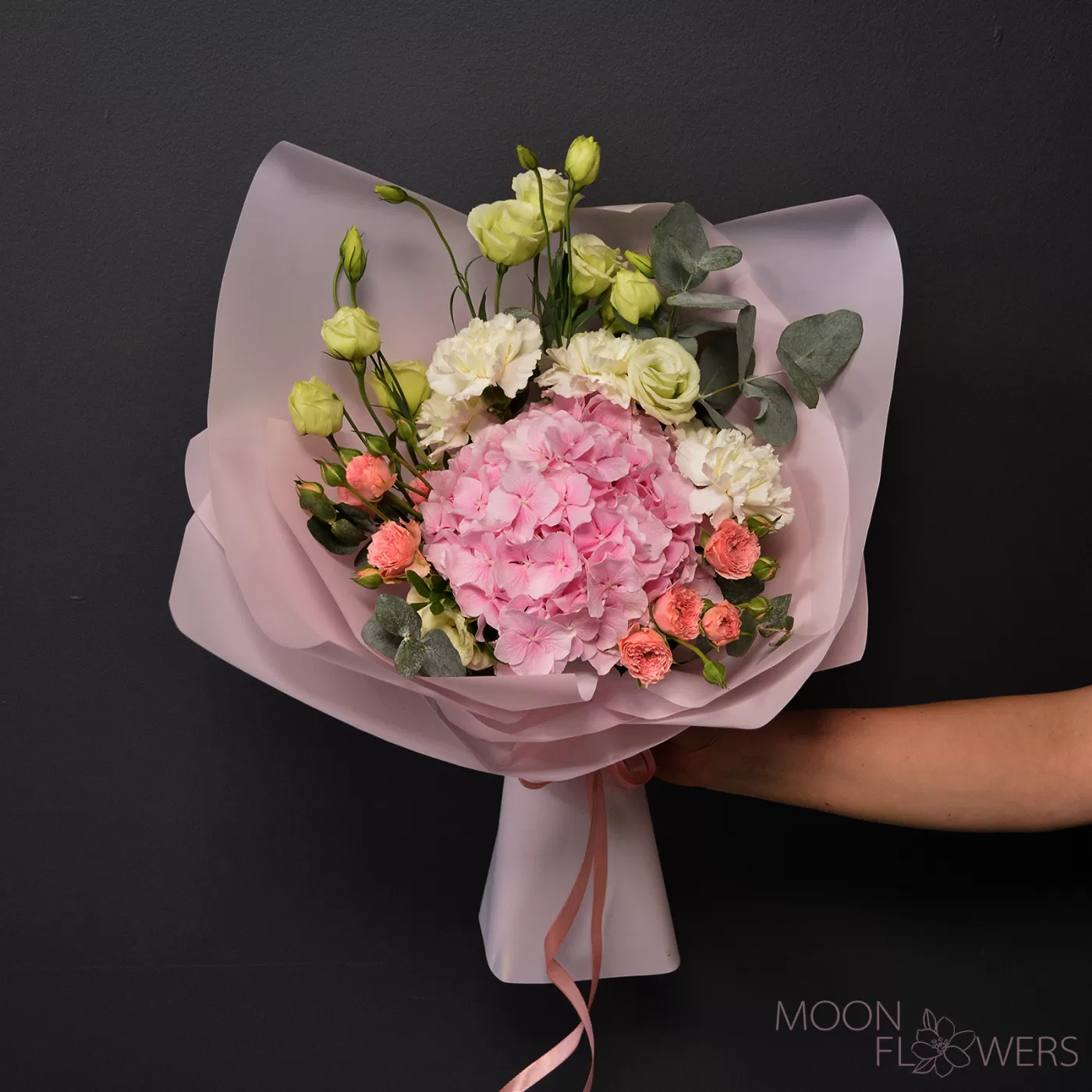 Bouquet of pink hydrangea, white carnations and eustoma