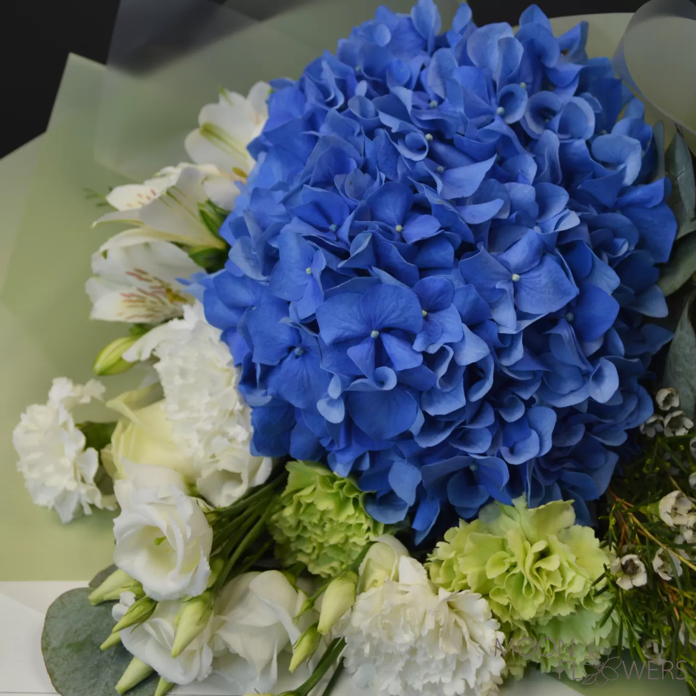 Bouquet of blue hydrangea, carnation and eustoma