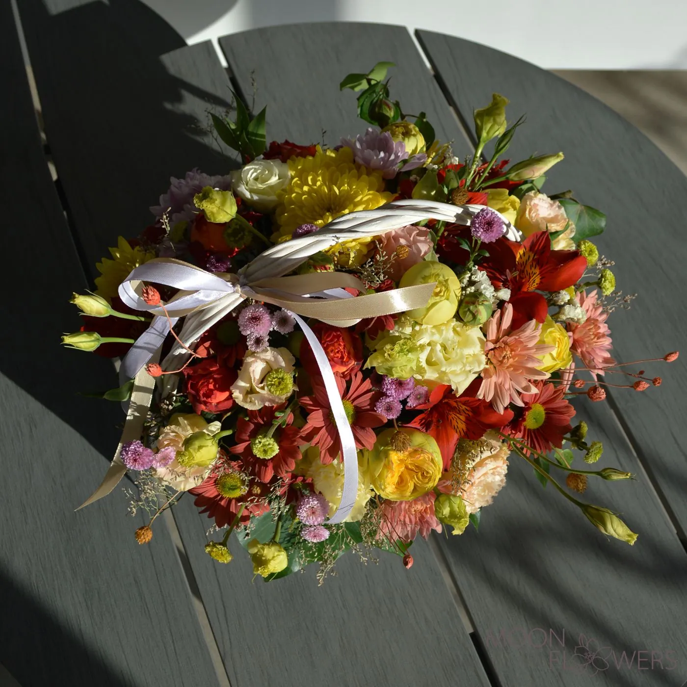 Basket with yellow and orange flowers (M)