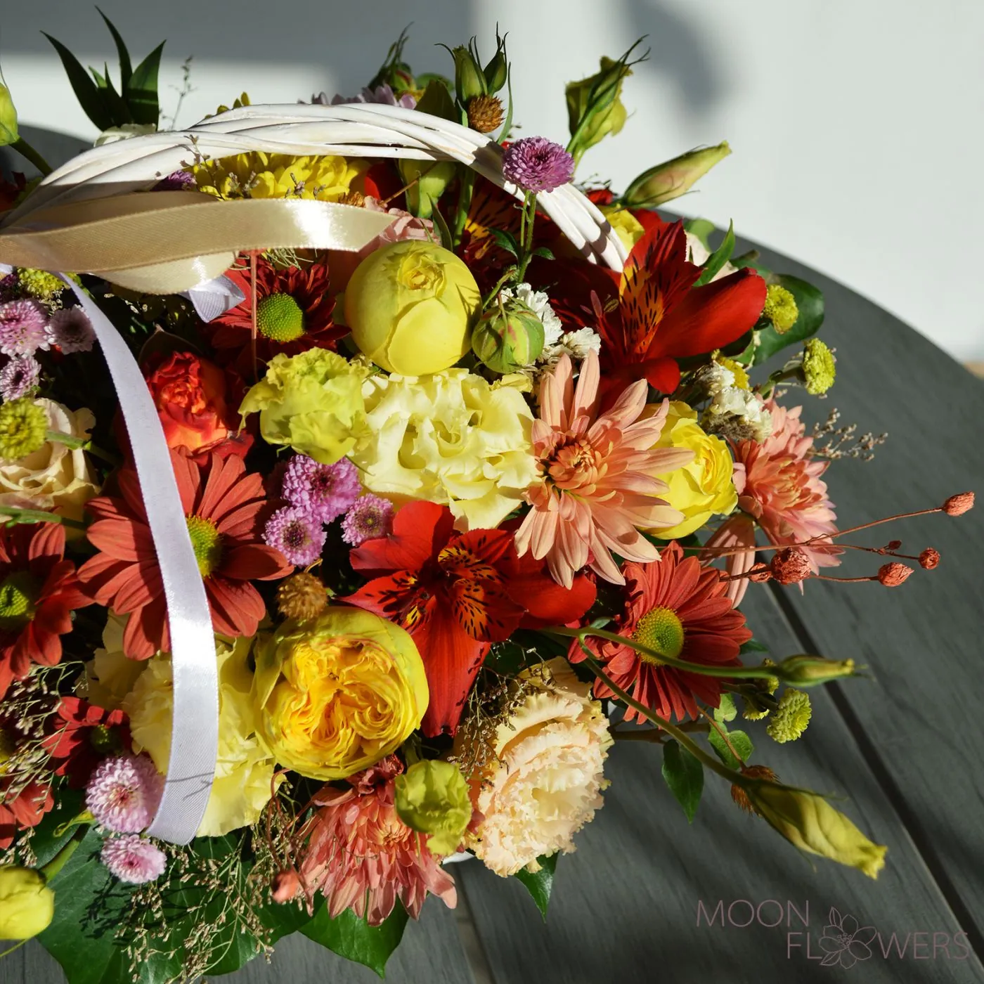 Basket with yellow and orange flowers (M)