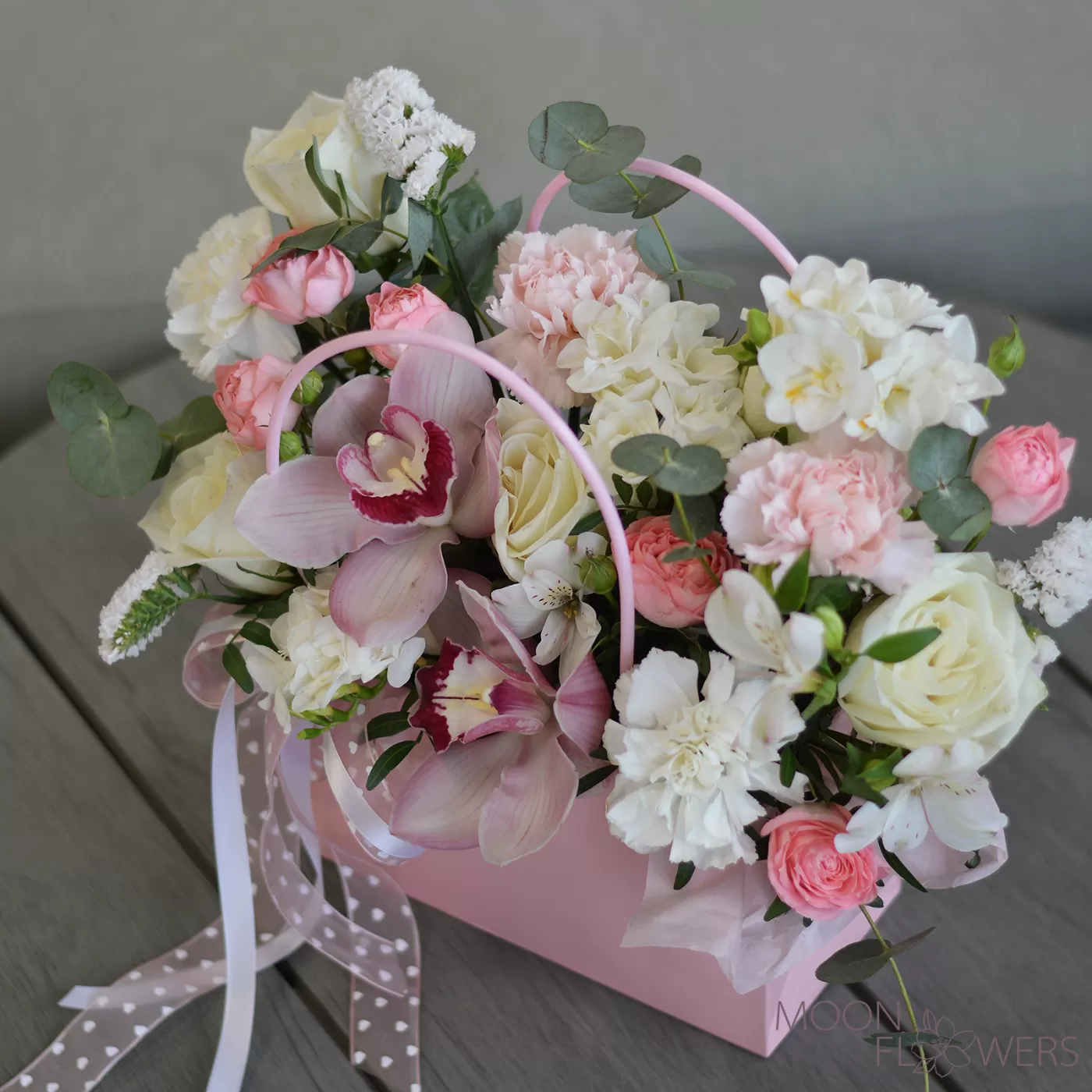 Handbag with roses, carnations and orchids